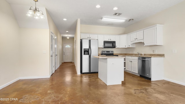 kitchen featuring white cabinets, appliances with stainless steel finishes, finished concrete floors, and a center island