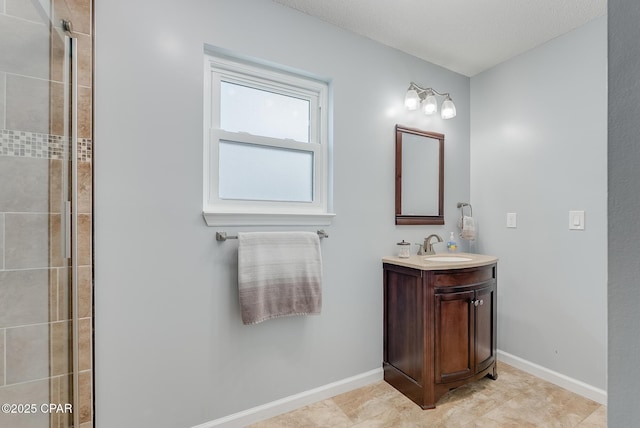 135 Bid A Wee Ln, Panama City Beach, FL 32413 - full bathroom featuring vanity, a tile shower, baseboards, and tile patterned floors