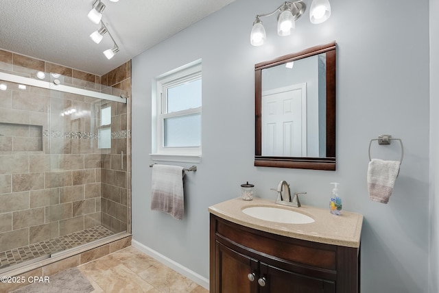 135 Bid A Wee Ln, Panama City Beach, FL 32413 - bathroom featuring a stall shower, vanity, and baseboards