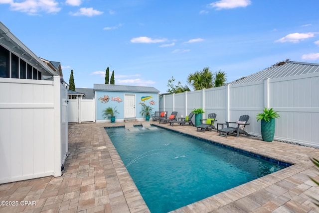 135 Bid A Wee Ln, Panama City Beach, FL 32413 - view of pool featuring a patio area, a fenced backyard, and an outdoor structure
