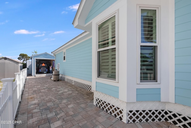 135 Bid A Wee Ln, Panama City Beach, FL 32413 - view of side of property featuring an outdoor structure and fence