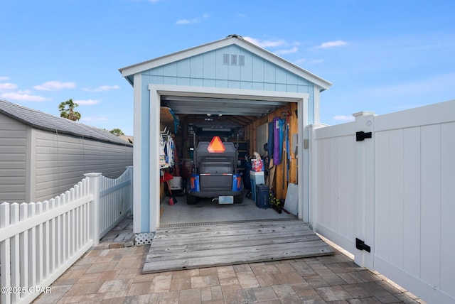 135 Bid A Wee Ln, Panama City Beach, FL 32413 - view of outdoor structure featuring fence and a gate