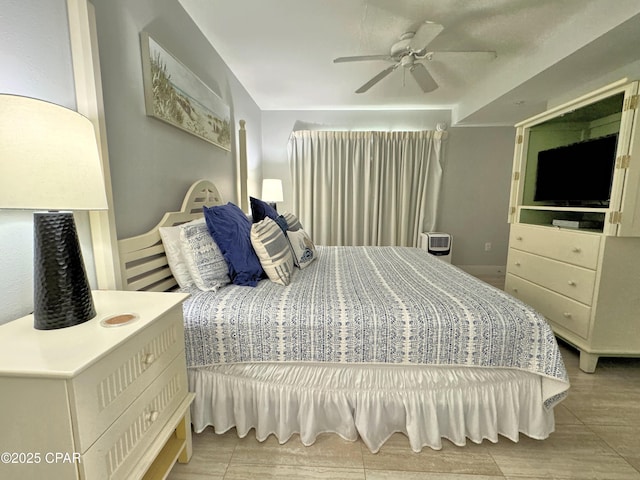 bedroom featuring a ceiling fan and light wood-type flooring