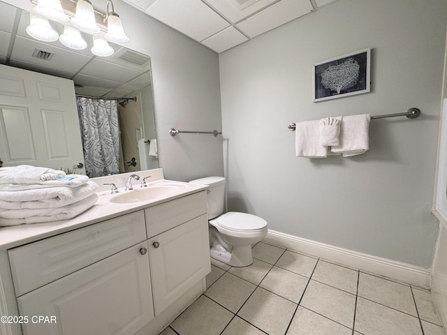 full bath with tile patterned flooring, a paneled ceiling, baseboards, and visible vents