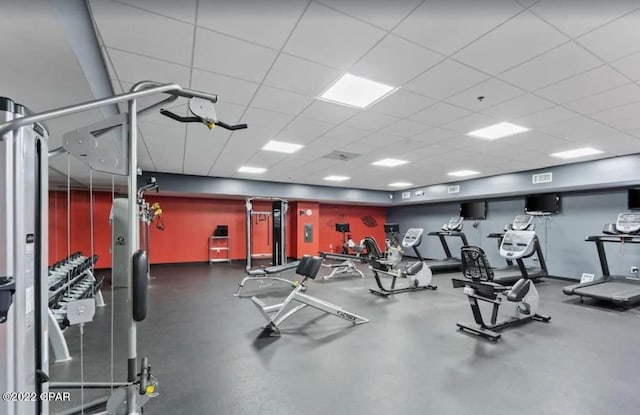 workout area featuring a paneled ceiling and visible vents