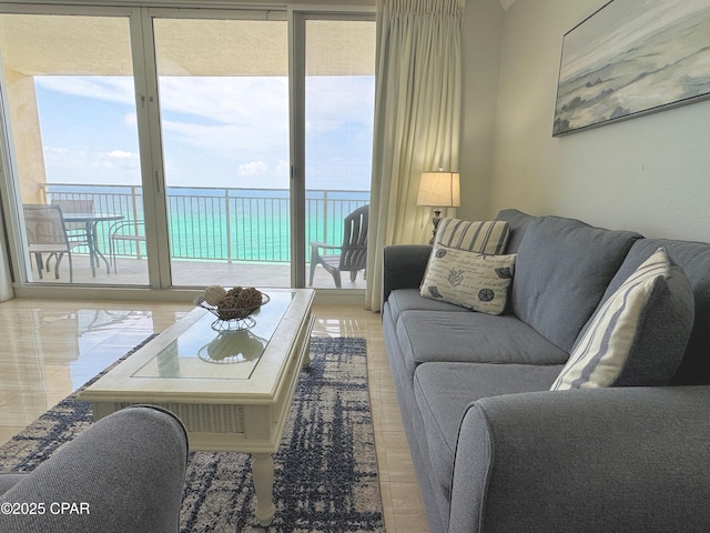 living area featuring a water view