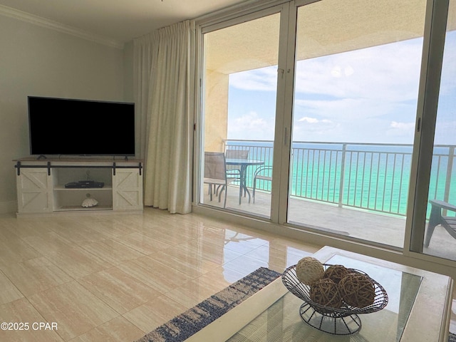 tiled living area with ornamental molding and a water view