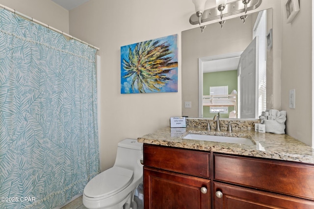 full bath featuring toilet, a shower with curtain, and vanity