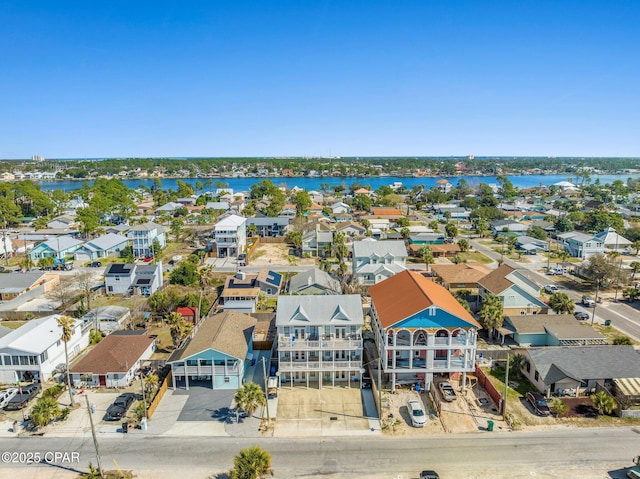 bird's eye view featuring a water view and a residential view