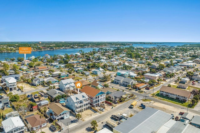 birds eye view of property with a water view and a residential view