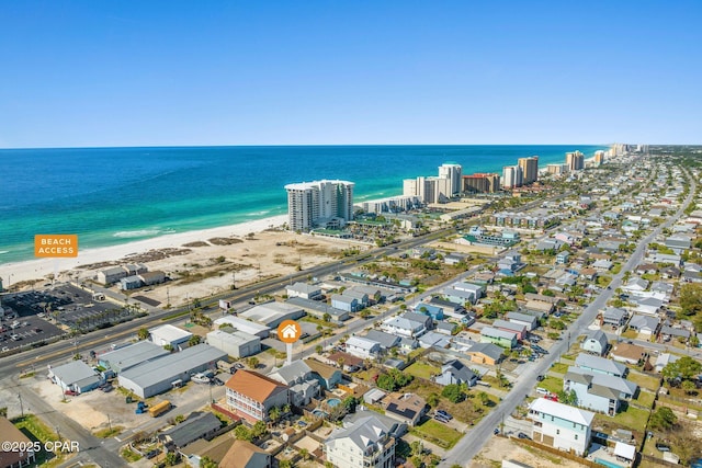 bird's eye view with a water view and a beach view