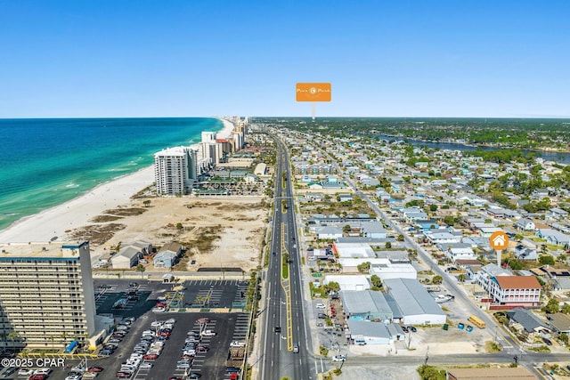 bird's eye view with a water view and a view of the beach