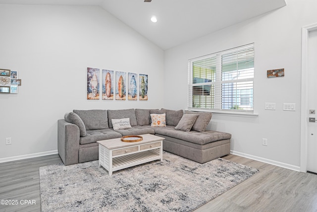 living area with wood finished floors, baseboards, ceiling fan, high vaulted ceiling, and recessed lighting
