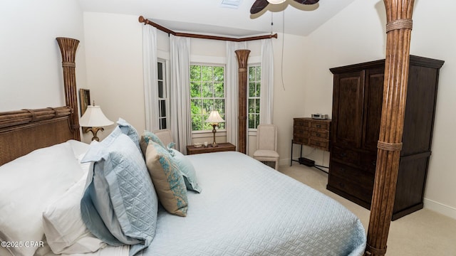 bedroom with ceiling fan, light colored carpet, baseboards, and visible vents