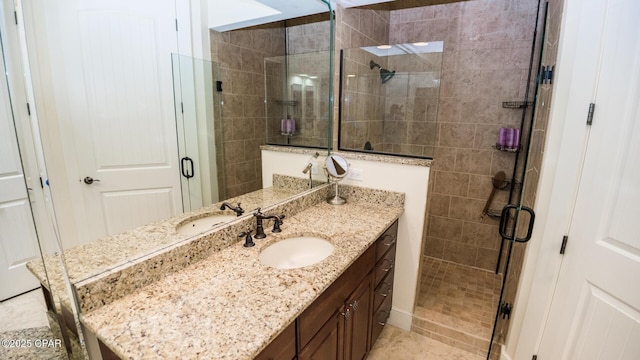 bathroom featuring vanity and a stall shower