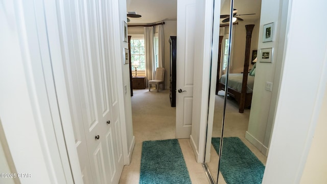hallway with light colored carpet