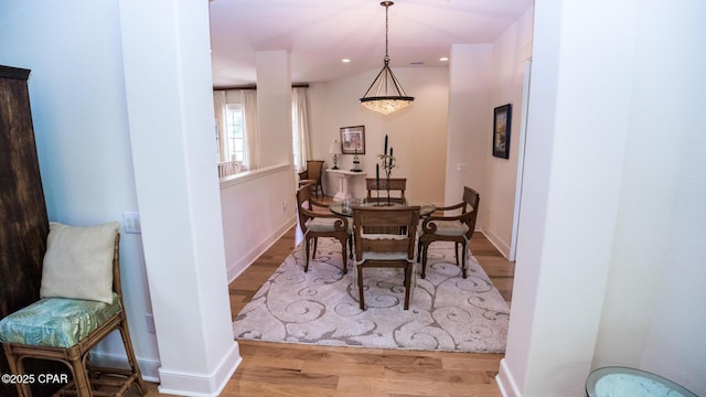 dining room featuring recessed lighting, baseboards, and wood finished floors