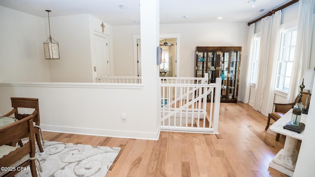 interior space featuring baseboards and wood finished floors