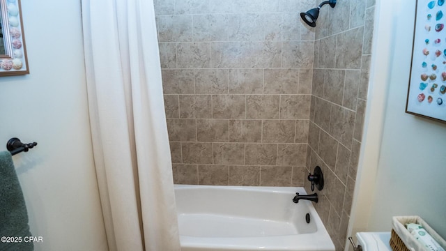 bathroom with shower / tub combo with curtain