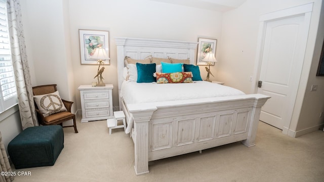 bedroom with light colored carpet