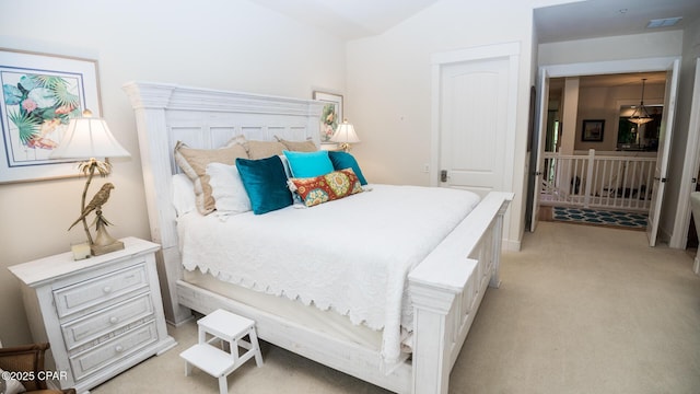 bedroom featuring light colored carpet