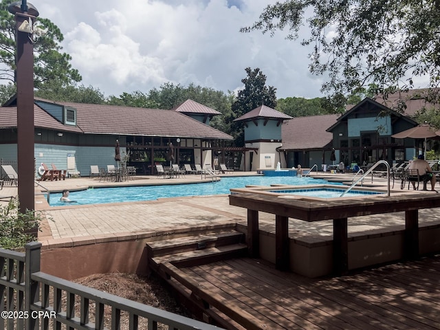 community pool featuring a patio area