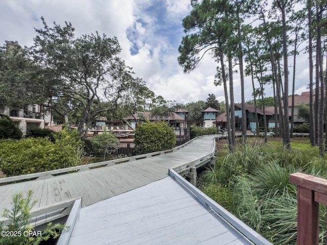 dock area with a residential view and a deck