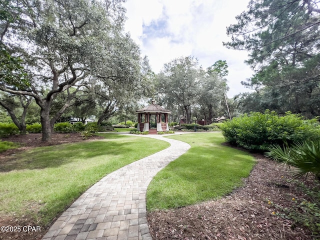 surrounding community featuring a gazebo and a lawn