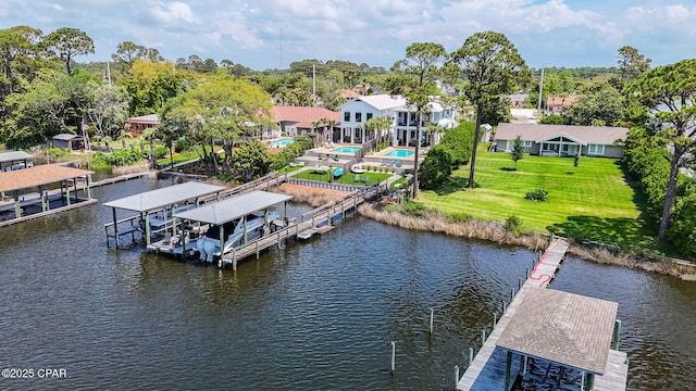 8597 N Lagoon Dr, Panama City, FL 32408 - view of dock featuring a water view, a lawn, and boat lift