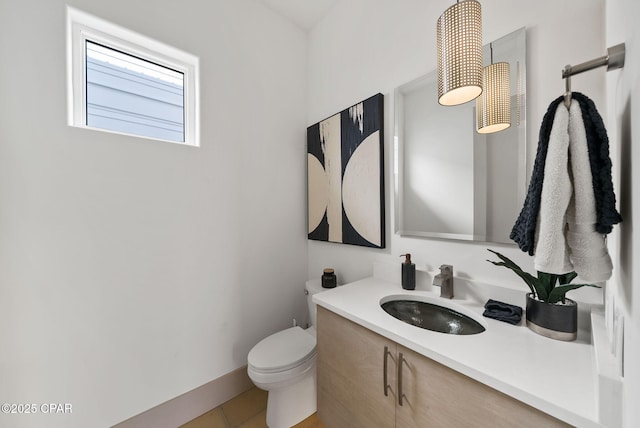 8597 N Lagoon Dr, Panama City, FL 32408 - half bath featuring tile patterned flooring, toilet, and vanity