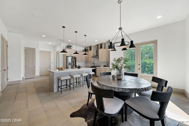 8597 N Lagoon Dr, Panama City, FL 32408 - dining space featuring an inviting chandelier, baseboards, and recessed lighting