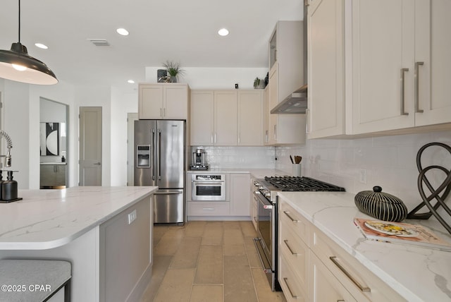 8597 N Lagoon Dr, Panama City, FL 32408 - kitchen with stainless steel appliances, visible vents, recessed lighting, wall chimney exhaust hood, and decorative backsplash