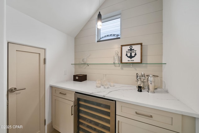 8597 N Lagoon Dr, Panama City, FL 32408 - bar featuring beverage cooler, a dry bar, vaulted ceiling, and wood walls
