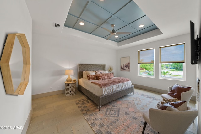 8597 N Lagoon Dr, Panama City, FL 32408 - bedroom featuring a ceiling fan, a tray ceiling, recessed lighting, baseboards, and visible vents