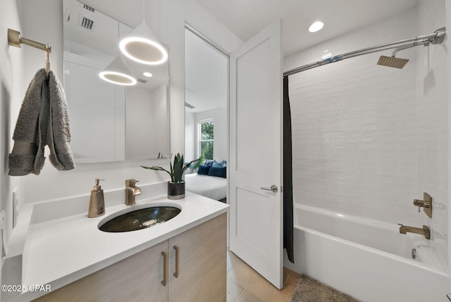 8597 N Lagoon Dr, Panama City, FL 32408 - full bath featuring vanity, shower / washtub combination, visible vents, and recessed lighting