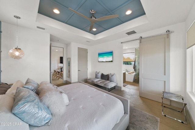 8597 N Lagoon Dr, Panama City, FL 32408 - bedroom with visible vents, a barn door, and recessed lighting