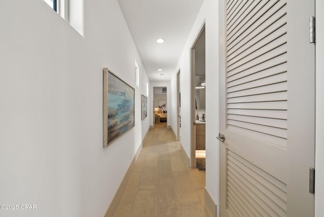 8597 N Lagoon Dr, Panama City, FL 32408 - corridor featuring baseboards and recessed lighting