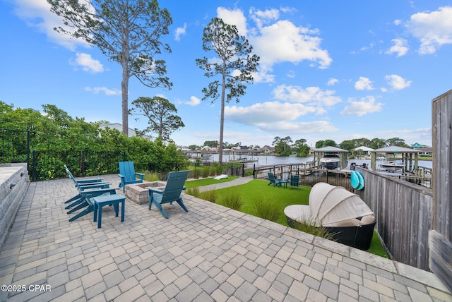 8597 N Lagoon Dr, Panama City, FL 32408 - view of patio / terrace featuring a water view