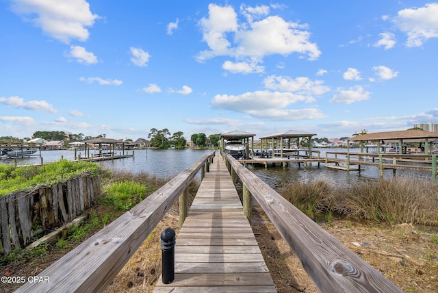 8597 N Lagoon Dr, Panama City, FL 32408 - dock area with boat lift and a water view