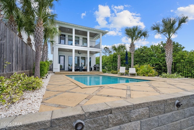 8597 N Lagoon Dr, Panama City, FL 32408 - view of swimming pool with a patio, fence, ceiling fan, grilling area, and a fenced in pool