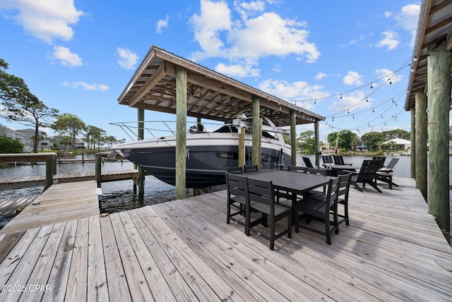 8597 N Lagoon Dr, Panama City, FL 32408 - dock area with a water view and boat lift