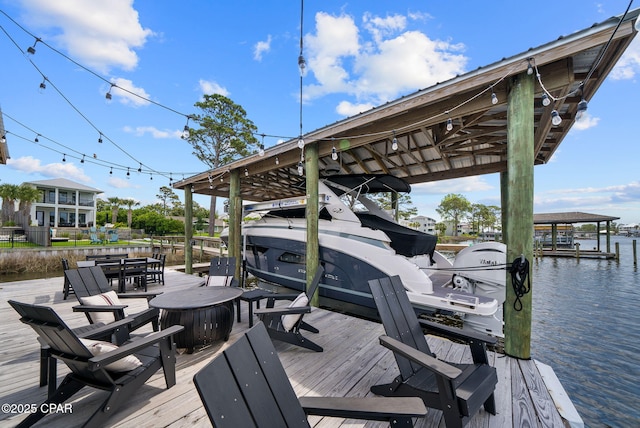 8597 N Lagoon Dr, Panama City, FL 32408 - view of dock featuring a water view and boat lift