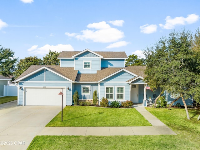 traditional home with an attached garage, fence, concrete driveway, a front lawn, and board and batten siding