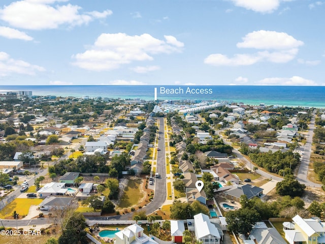 drone / aerial view with a water view and a residential view
