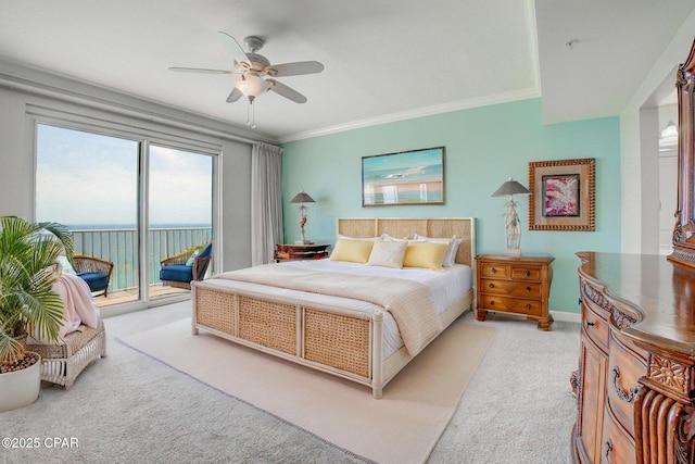 8601 Surf Dr Unit 14E, Panama City, FL 32408 - bedroom featuring ornamental molding, a ceiling fan, light carpet, and access to exterior