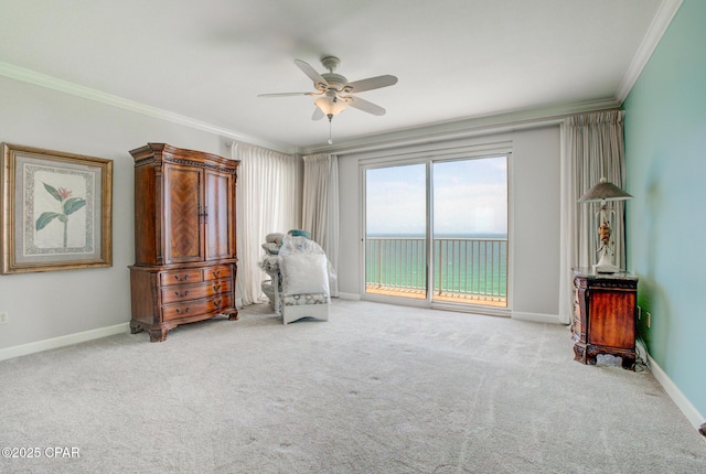 8601 Surf Dr Unit 14E, Panama City, FL 32408 - sitting room with carpet floors, ornamental molding, baseboards, and ceiling fan