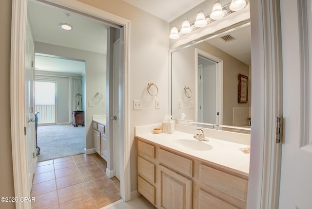 8601 Surf Dr Unit 14E, Panama City, FL 32408 - bathroom featuring tile patterned floors, visible vents, baseboards, and vanity