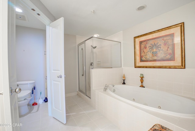 8601 Surf Dr Unit 14E, Panama City, FL 32408 - bathroom with a jetted tub, tile patterned flooring, a stall shower, and toilet