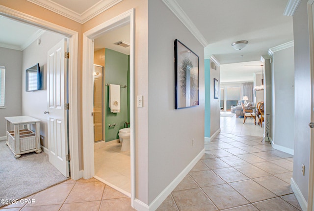 8601 Surf Dr Unit 14E, Panama City, FL 32408 - hall with crown molding, baseboards, light tile patterned floors, and visible vents