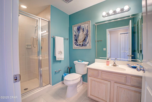 8601 Surf Dr Unit 14E, Panama City, FL 32408 - bathroom featuring vanity, toilet, tile patterned floors, baseboards, and a stall shower